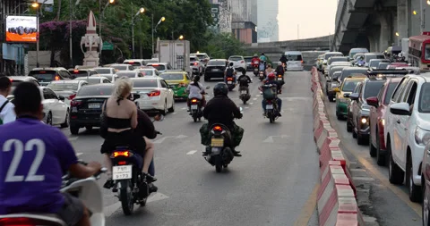 Mixed traffic with some lanes standing still at evening hour in Bangkok Stock Footage 326384423