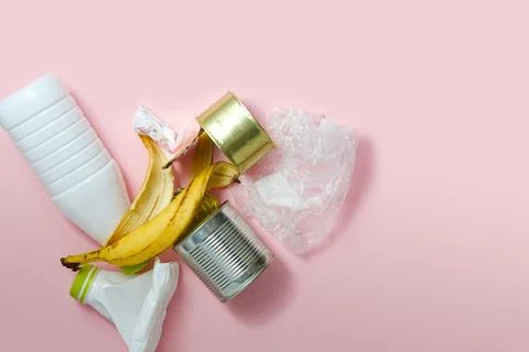 Mixed trash on a pink background. Separate waste collection on a pink background Stock Photos