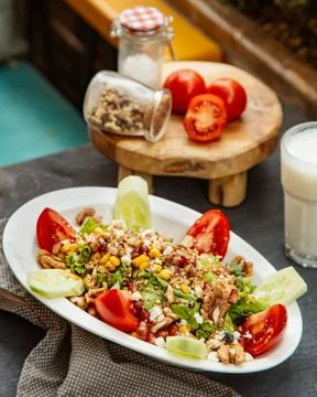Mixed vegetable salad with walnuts Stock Photos