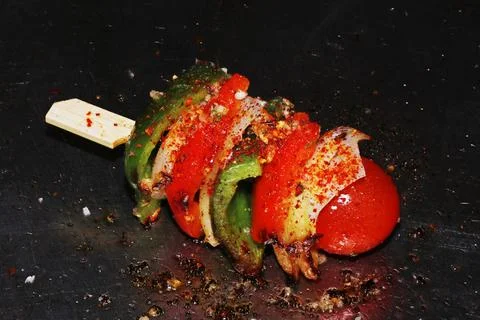 Mixed vegetable skewer with pepppers, zuchinni and tomato cooked on a hot gri Stock Photos