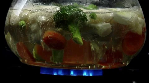 Mixed vegetables being boiled in water Stock Footage 8573673
