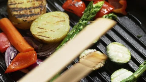 Mixed vegetables being grilled on a cast iron grill pan Stock Footage 76583567