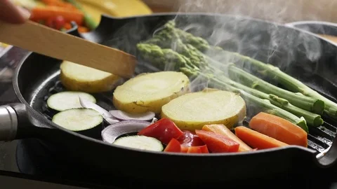 Mixed vegetables being grilled on a cast iron grill pan Stock Footage 76583596