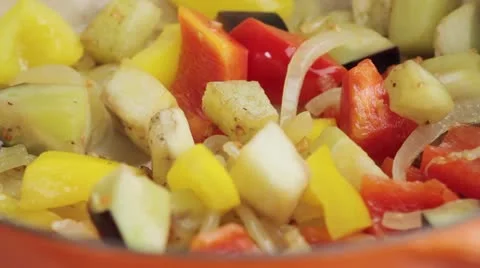 Mixed vegetables being stirred in a pan Stock Footage 24656846
