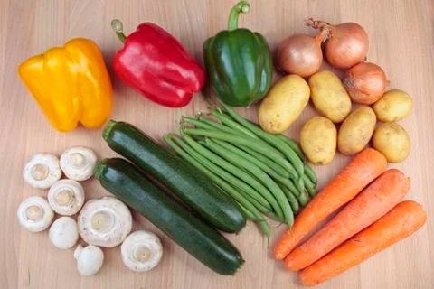 Mixed vegetables on chopping board Stock Photos