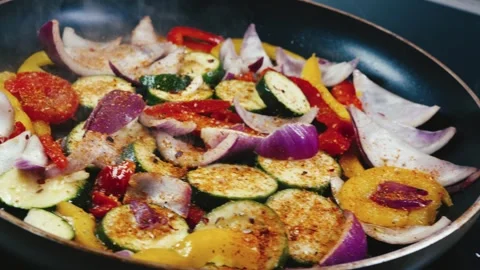 Mixed Vegetables Frying in Pan Stock Footage 323224418