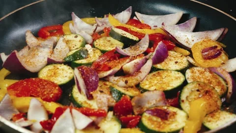 Mixed Vegetables Frying in Pan Stock Footage 323224447