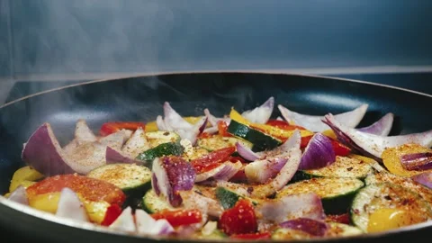 Mixed Vegetables Frying in Pan Stock Footage 323224458