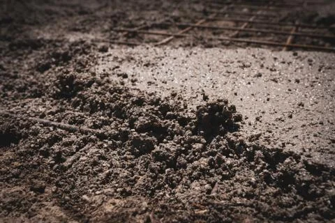 Mixed wet cement solution used for floor or sidewalk renovation Stock Photos