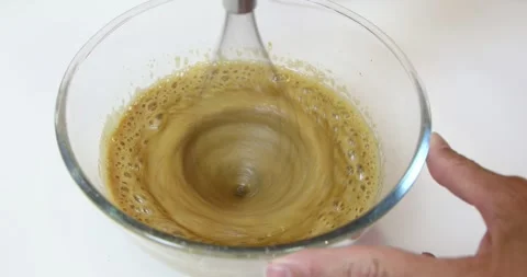 Mixer beating eggs with brown sugar Stock Footage 296382508
