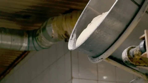 Mixer dumps the dough Stock Footage 76876620