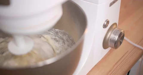 Mixer interferes with baking dough Stock Footage 128457160