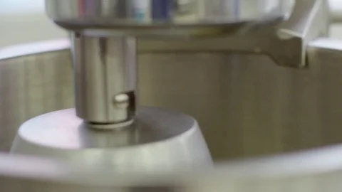Mixer machine is whipping the cream, doing circular motions, close-up view Stock-Footage 72252302