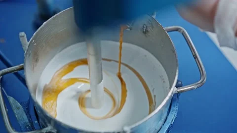 Mixer mixes the paint in the container Stock Footage 239859775