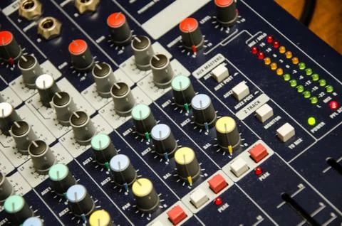 Mixer of a team that is responsible for controlling the audio system. Stock Photos