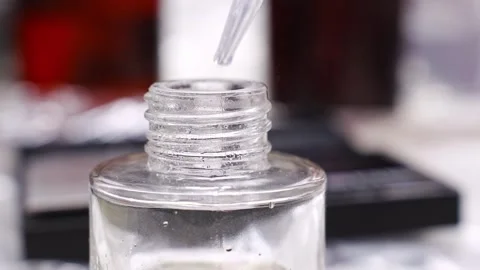 Mixing alcohol and essential oils to create aroma diffusers at home Stock Footage 304500637