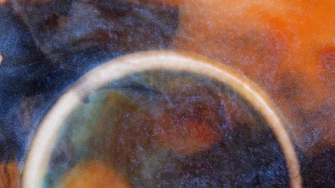 Mixing alcohol ink in a circular pattern on a surface Stock Footage 344651071