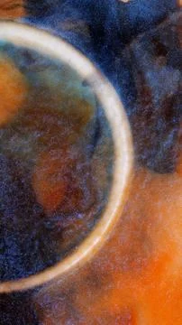 Mixing alcohol ink in a circular pattern during a creative process Stock Photos