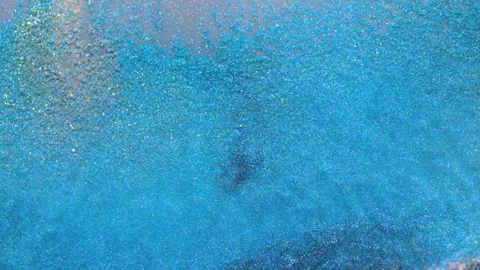 Mixing alcohol ink to create unique patterns on a dark surface Stock Footage 344724866