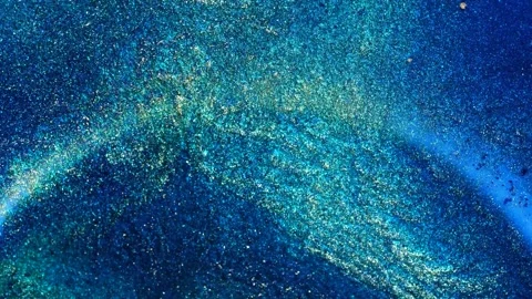 Mixing alcohol ink creates patterns in a bright setting Stock Footage 344697790