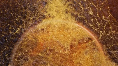 Mixing of alcohol ink creating patterns and colors in close-up view Stock Footage 344652062