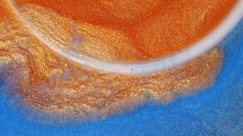 Mixing alcohol ink on a surface with swirling patterns and textures Stock Footage 344652726