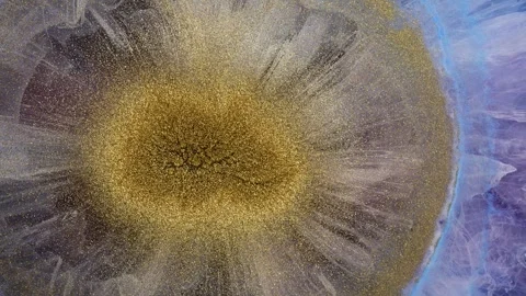 Mixing alcohol inks and epoxy resin to create colorful designs Stock Footage 342973325