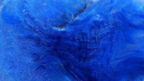 Mixing alcohol inks and epoxy resin to create colorful designs Stock Photos