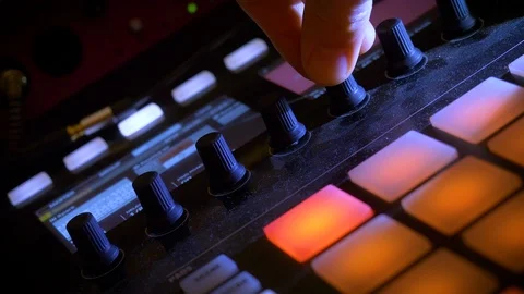 Mixing and playing on drum computer and synthesizer Stock Footage 107383720