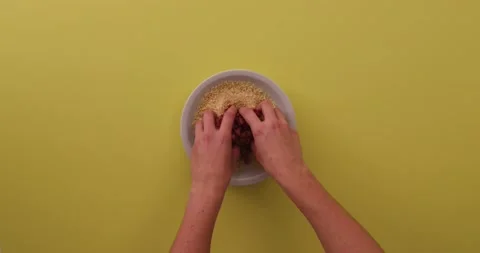 Mixing the bacon and breading together with hands 1 Video stock 132136372