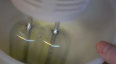 Mixing Batter with High-speed Motorized Egg Beater Stock Footage 46628589