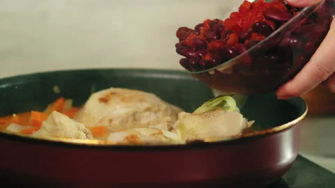 Mixing beans with chicken thighs Stock Footage 165597852