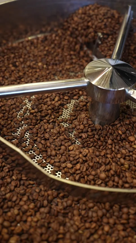 Mixing beans in Coffee Roastery machine Stock Footage 310042914