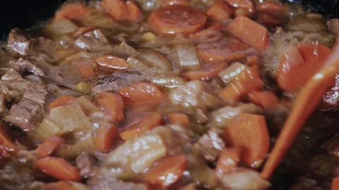 Mixing beef stew with vegetables close-up Stock Footage 102777186
