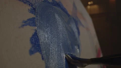 Mixing Blue and White Paint on a Canvas Stock Footage 156533220