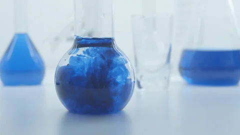 Mixing blue ink with water. Stock Footage 248222285