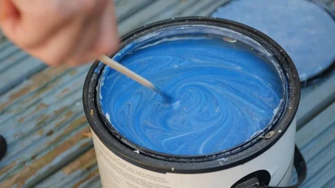 Mixing a blue pot of paint Stock Footage 115057591