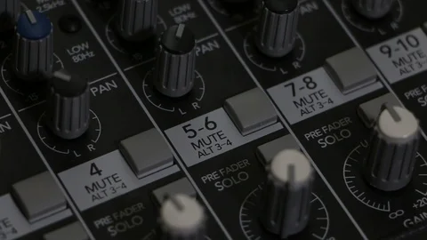 Mixing board panning closeup while turning knobs Stock-Footage 88676637