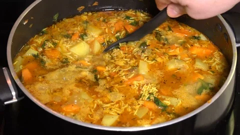 Mixing boiling vegetable and meat Stock Footage 106648301