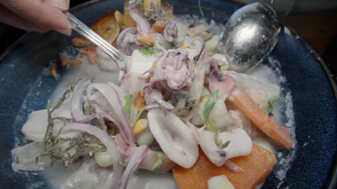 Mixing up a bowl of Peruvian ceviche 스톡 동영상 340053213