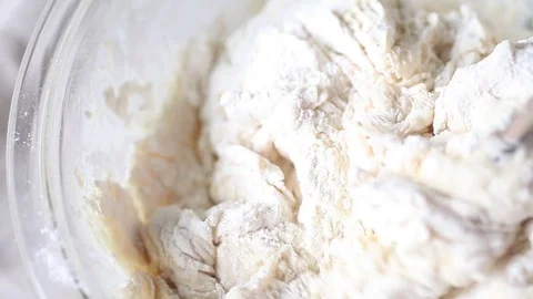 Mixing bread dough Stock Footage 75419942