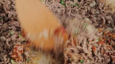 Mixing browned minced meat with tomato puree Stock Footage 24654985