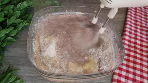Mixing Cake Batter with Electric Mixer in Glass Bowl - 4K Stock Footage 346449653