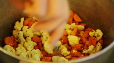 Mixing cauliflower with carrots Stock Footage 40732286