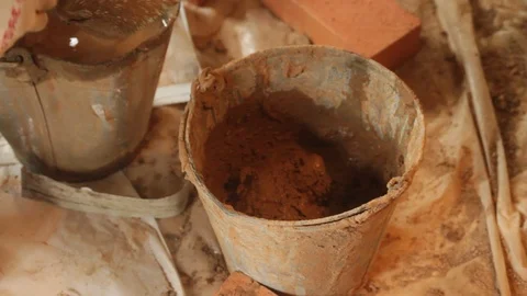 Mixing of cement in a bucket Stock Footage 97226288