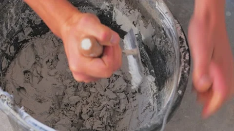 Mixing cement In the bucket Stock Footage 142951442