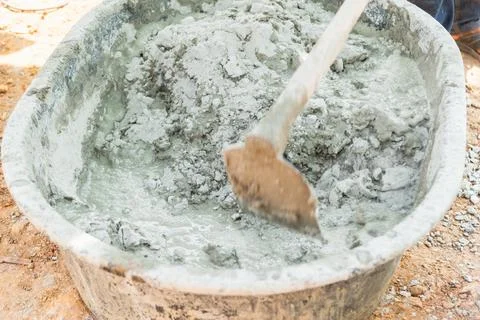 Mixing cement for construction projects in urban areas work process outdoor.. Stock Photos
