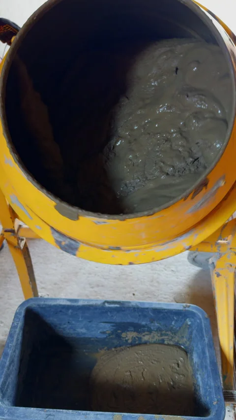 Mixing cement in portable drum. Vertical video. Video stock 321888249
