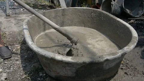 Mixing a cement in salver for applying construction Stock Footage 83784443