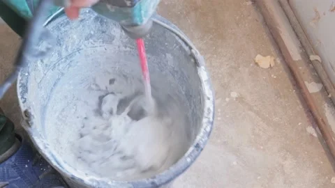Mixing a cement in salver for construction Video stock 142950677